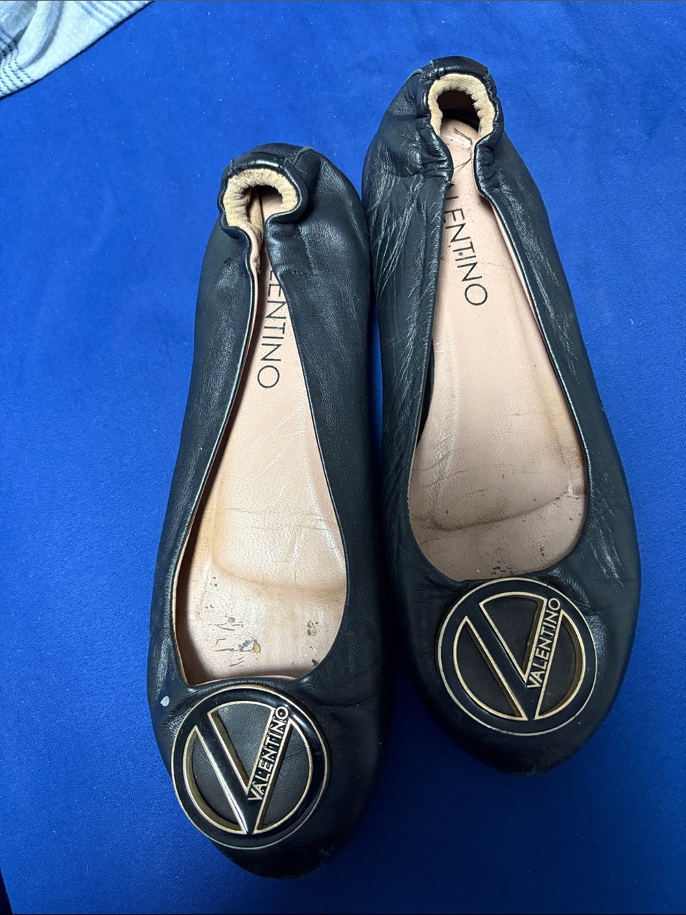 Valentino Black Leather Ballet Flats with Gold Logo Medallion